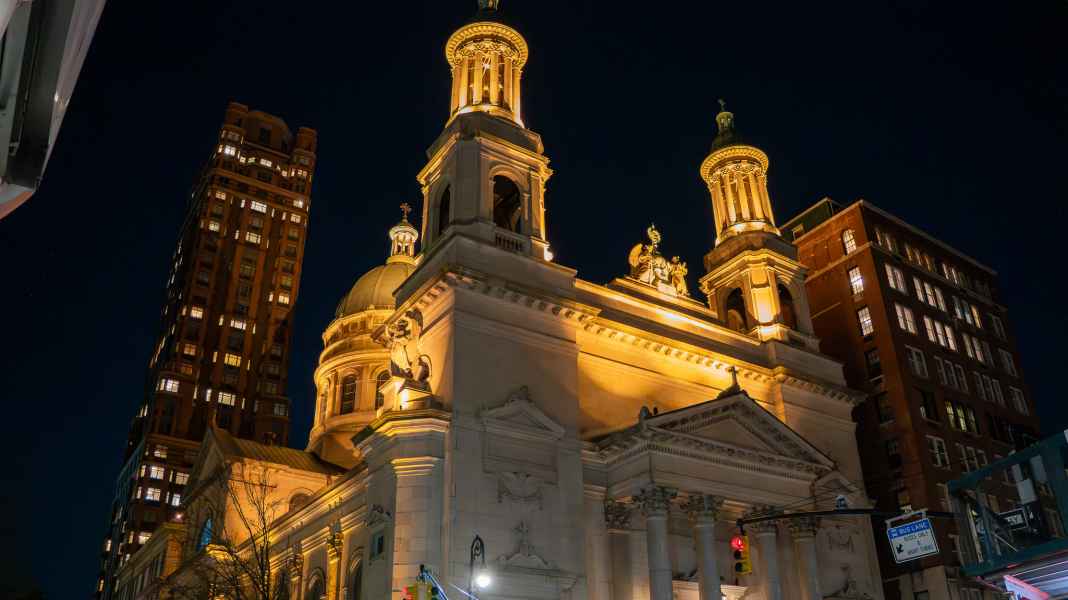 Side View of Saint John Baptiste Church in NYC At Night
